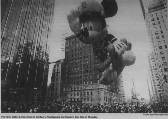Sailor Mickey floats in the parade